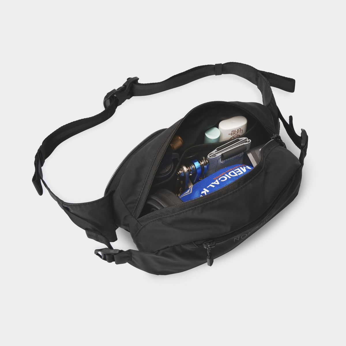 Nomatic Navigator Collapsible Sling 3L Black Front Angle View With Straps and Items Inside
