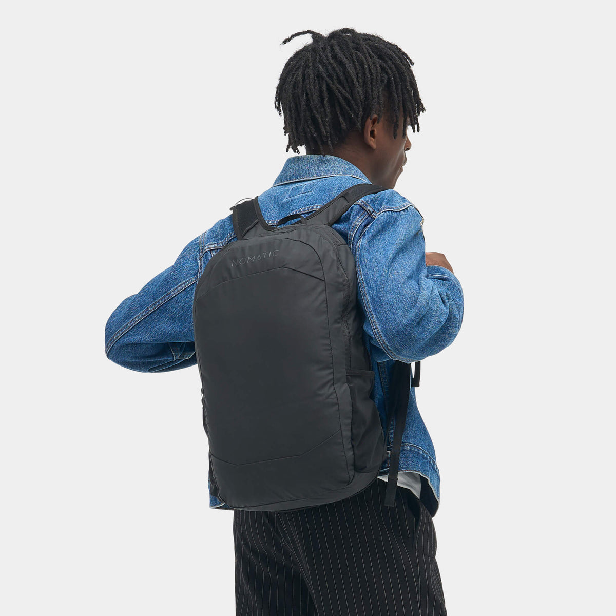Navigator Collapsible Pack 16L Black shown on person side view