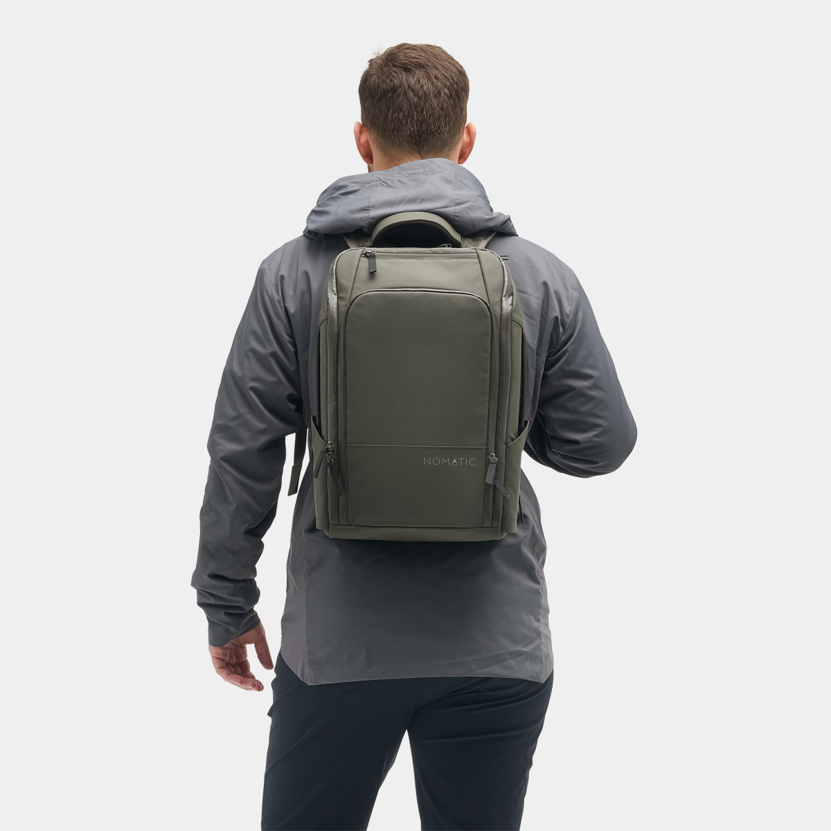 Nomatic Travel Pack 14L olive on model - lifestyle urban commute