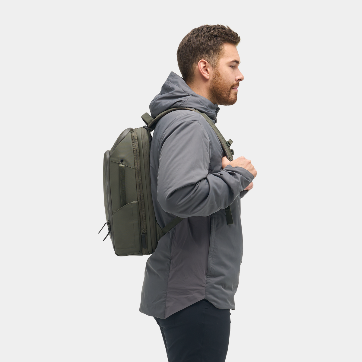 Nomatic Travel Pack 14L olive on model - digital nomad travel lifestyle