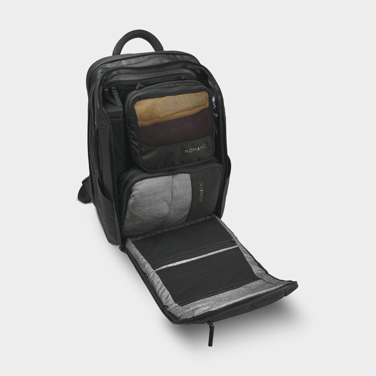 Nomatic Travel Pack 20L open top view showing 22-pocket interior organization with laptop sleeve and RFID compartment