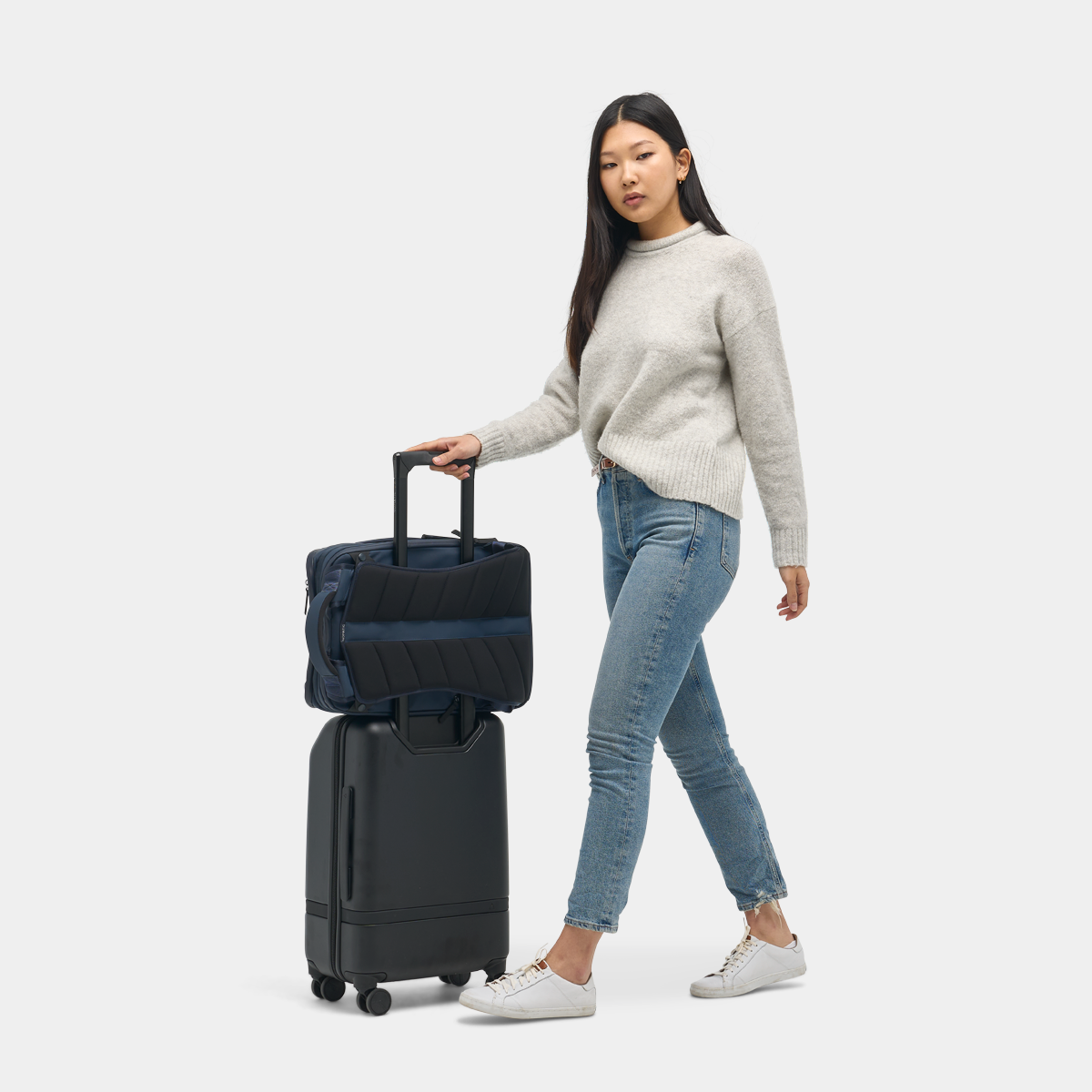Nomatic Travel Pack 20L navy side angle showing sleek profile